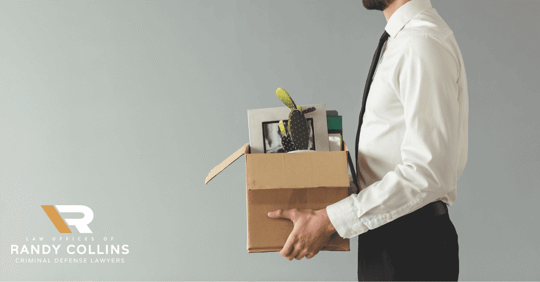 man fired walking out with box of office supplies